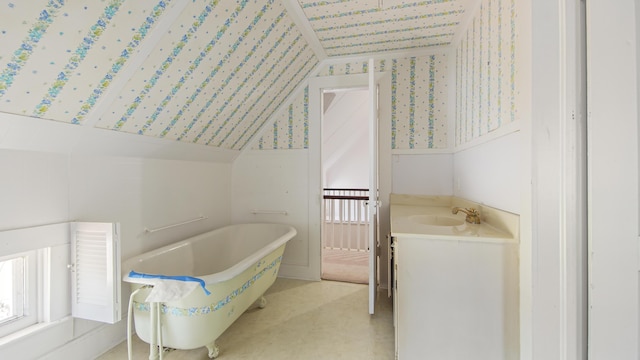 bathroom with sink and a tub to relax in