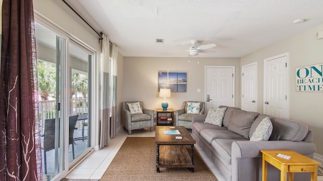 living room with ceiling fan and light tile floors