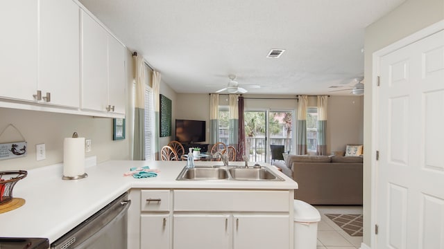 kitchen featuring dishwasher, sink, white cabinetry, and ceiling fan