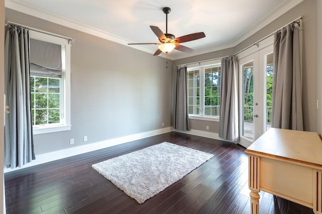 empty room featuring plenty of natural light, french doors, and dark hardwood / wood-style floors