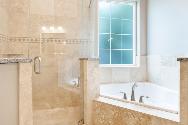 bathroom with shower with separate bathtub