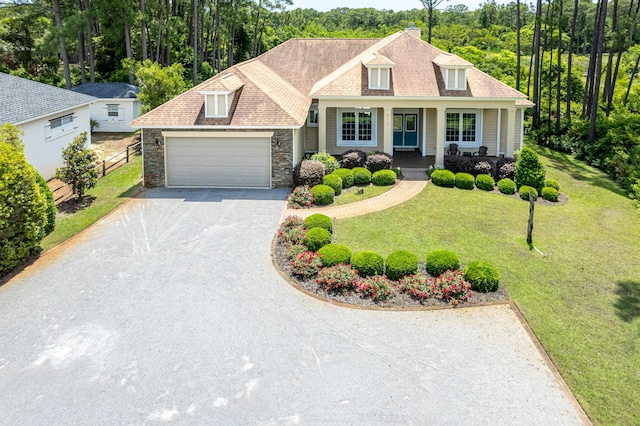 view of front of home with a garage and a front yard