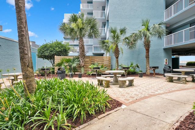 view of property's community with a patio