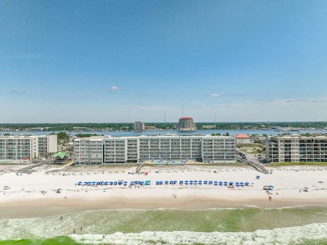 aerial view featuring a water view and a beach view