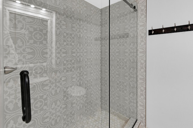 bathroom with tiled shower