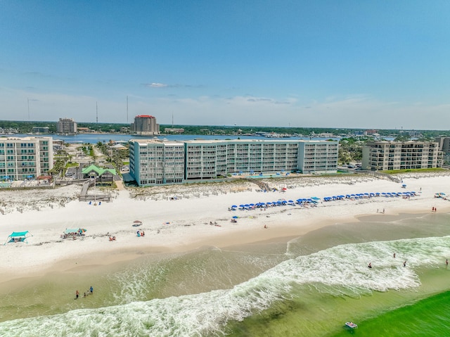 birds eye view of property featuring a view of the beach and a water view