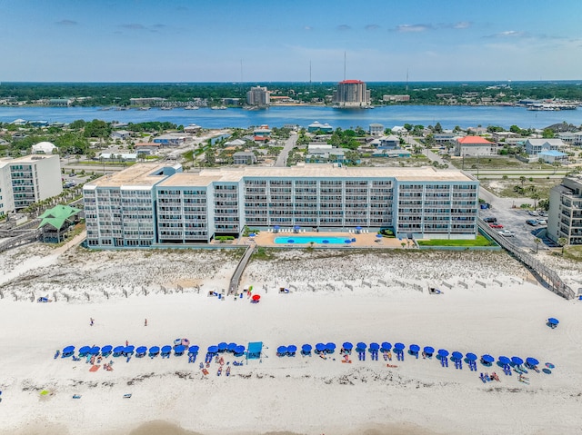 birds eye view of property featuring a water view and a view of the beach