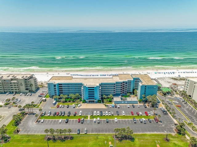 birds eye view of property with a view of the beach and a water view