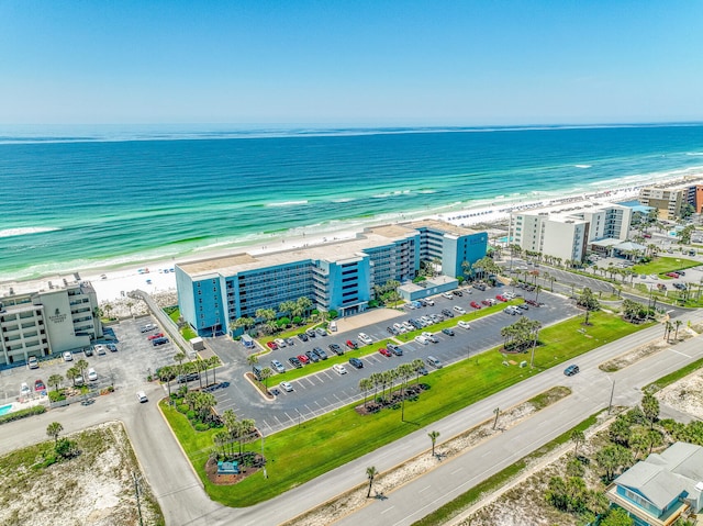 drone / aerial view with a water view and a view of the beach