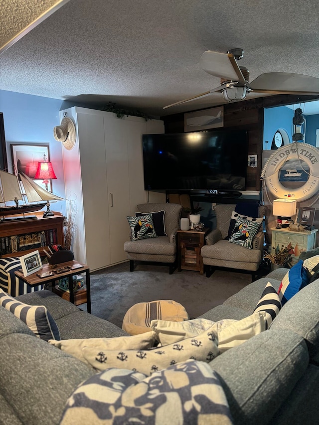 carpeted living room with ceiling fan and a textured ceiling