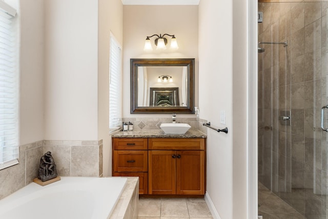 bathroom with vanity, separate shower and tub, tile floors, and a wealth of natural light