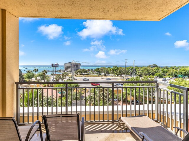 balcony featuring a water view