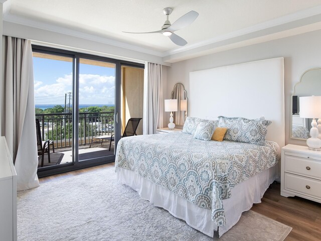 bedroom with hardwood / wood-style floors, ornamental molding, ceiling fan, and access to exterior