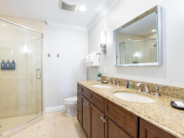 bathroom with walk in shower, toilet, double sink, and large vanity