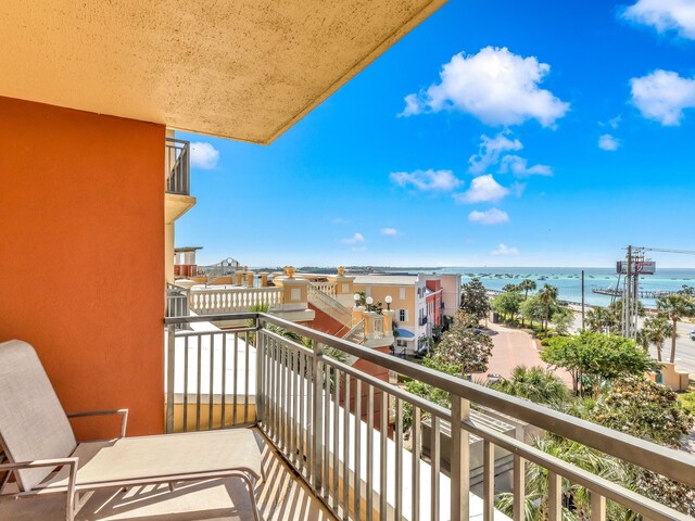 balcony featuring a water view