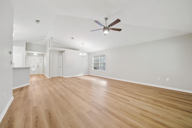 unfurnished living room with light hardwood / wood-style floors, ceiling fan with notable chandelier, and vaulted ceiling