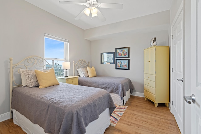 bedroom with ceiling fan and light hardwood / wood-style flooring