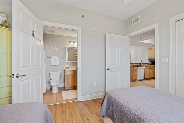 tiled bedroom featuring sink and connected bathroom