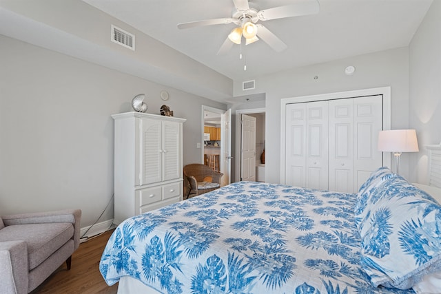 bedroom featuring ceiling fan, a closet, and hardwood / wood-style floors