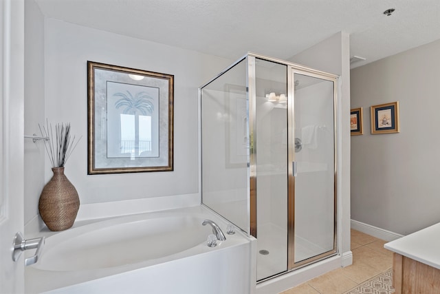 bathroom with separate shower and tub, vanity, a textured ceiling, and tile floors