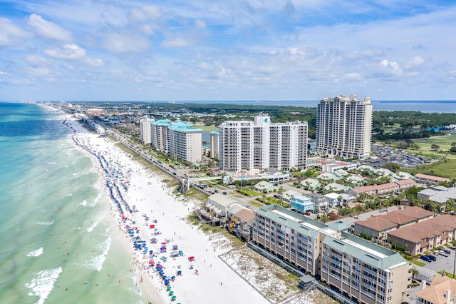 birds eye view of property with a beach view and a water view