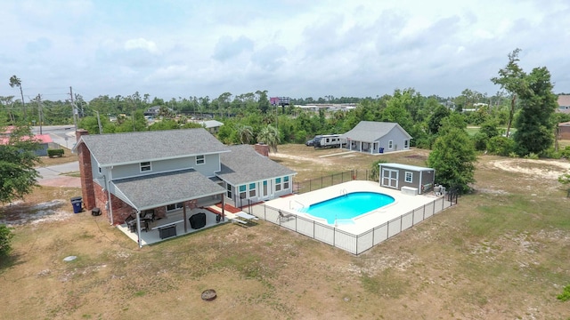 view of swimming pool with an outbuilding