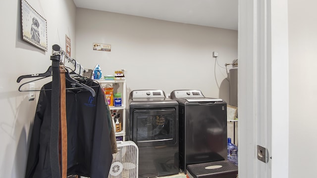 laundry room featuring washing machine and clothes dryer