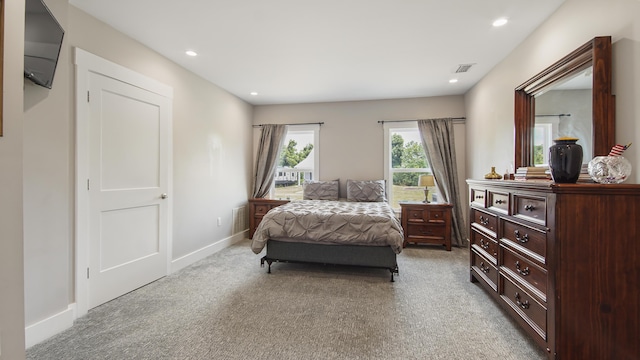 bedroom featuring light colored carpet