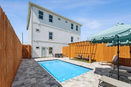 view of swimming pool with a patio