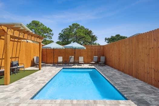 view of swimming pool with a patio area