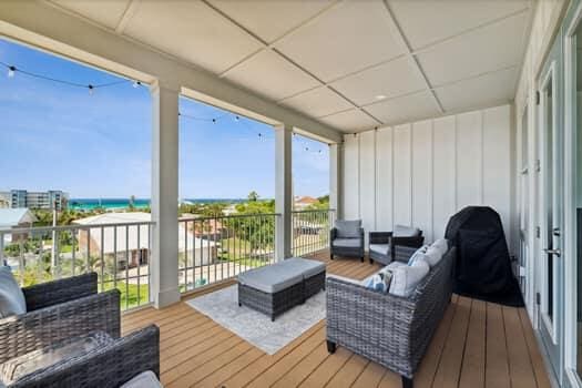 sunroom / solarium with a paneled ceiling