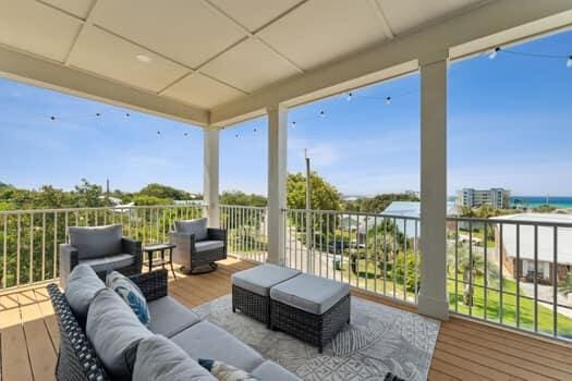 wooden deck with an outdoor living space