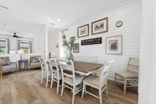 dining room with ceiling fan and light wood-type flooring