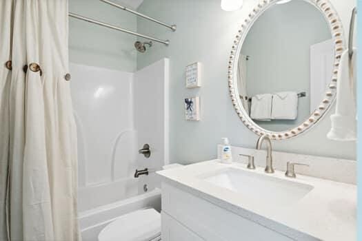 full bathroom featuring vanity, toilet, and shower / tub combo with curtain