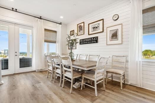 dining space with light hardwood / wood-style floors and french doors