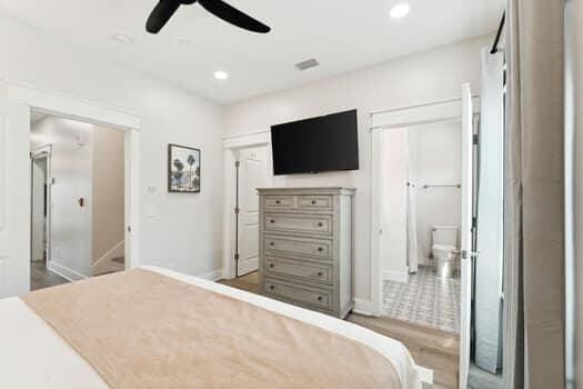 tiled bedroom with ceiling fan