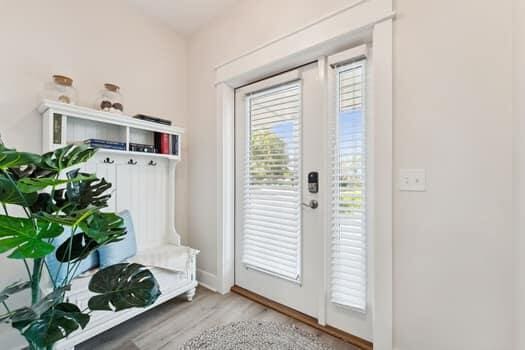 mudroom with light hardwood / wood-style floors and a healthy amount of sunlight