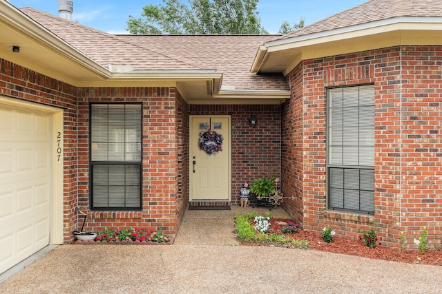 entrance to property featuring a garage