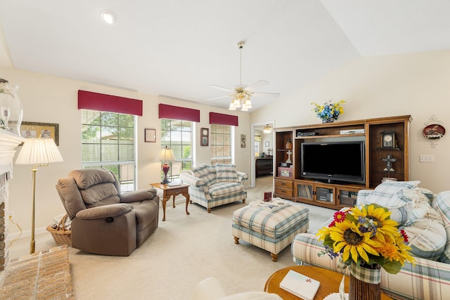 living room with carpet flooring, ceiling fan, and vaulted ceiling