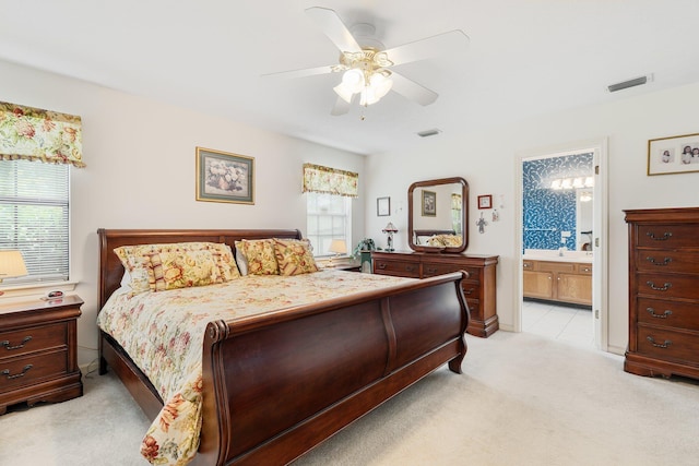 carpeted bedroom featuring ceiling fan, sink, and ensuite bathroom