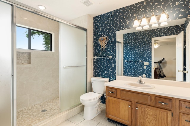 bathroom featuring tile flooring, an enclosed shower, toilet, and large vanity