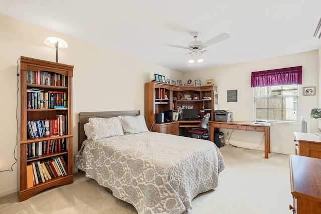 bedroom featuring light carpet and ceiling fan