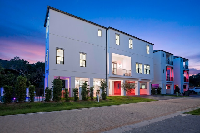 view of outdoor building at dusk