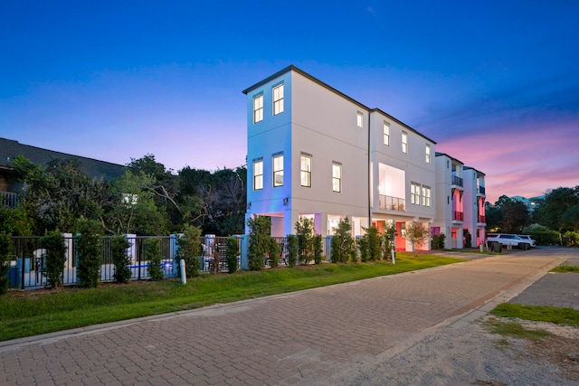 view of outdoor building at dusk