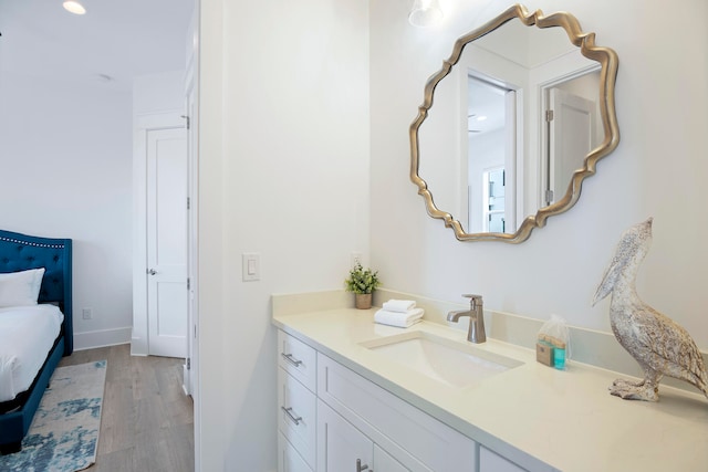 bathroom with vanity and hardwood / wood-style floors