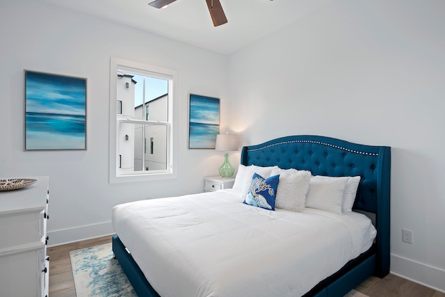 bedroom with wood-type flooring and ceiling fan