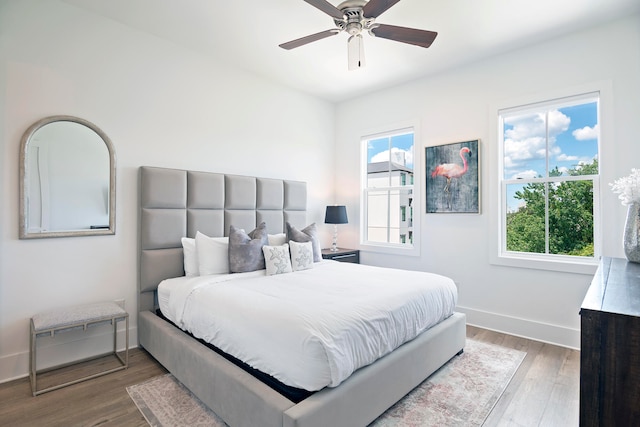 bedroom with ceiling fan and hardwood / wood-style floors