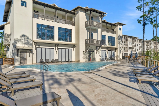 community pool with a patio