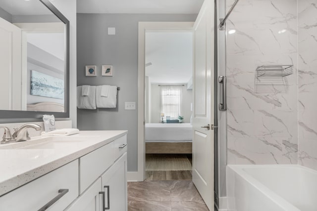 full bathroom featuring shower / bathtub combination, connected bathroom, vanity, baseboards, and marble finish floor