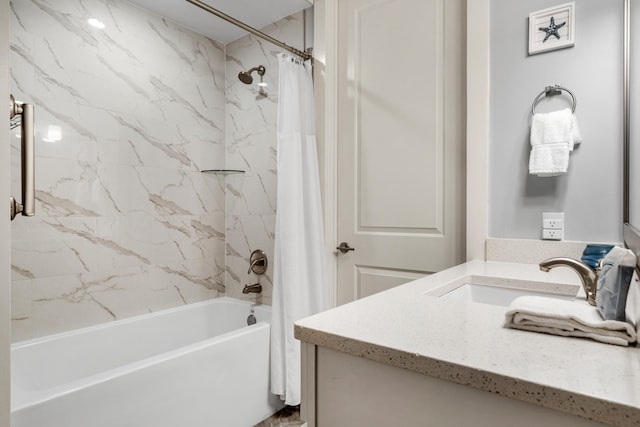 bathroom featuring shower / tub combo and vanity